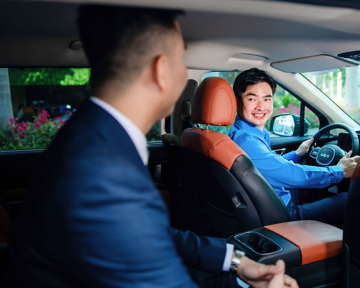 Executive and driver inside a car