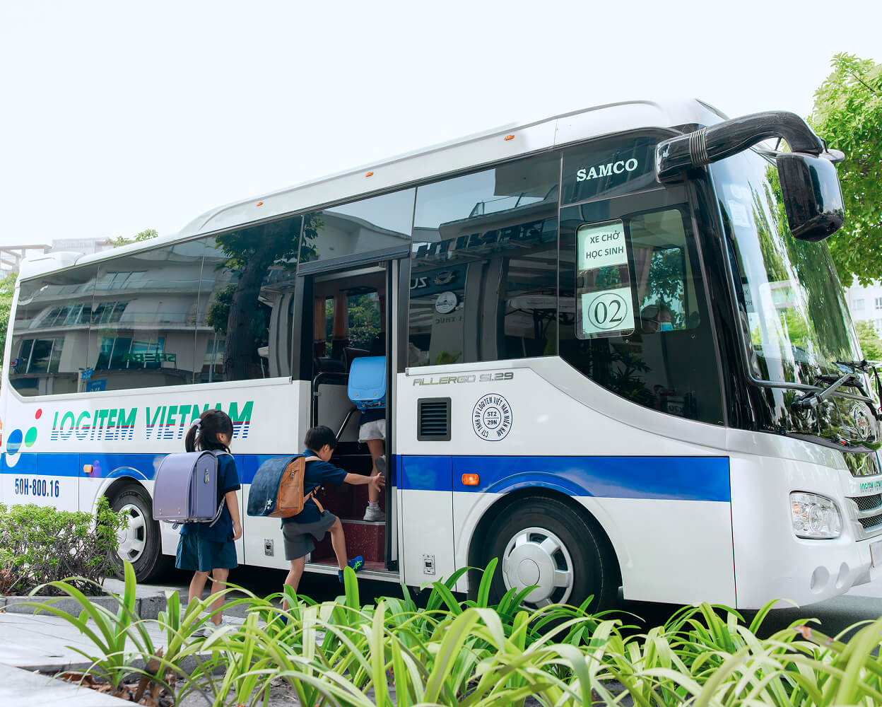 Elementary school children riding a school bus
