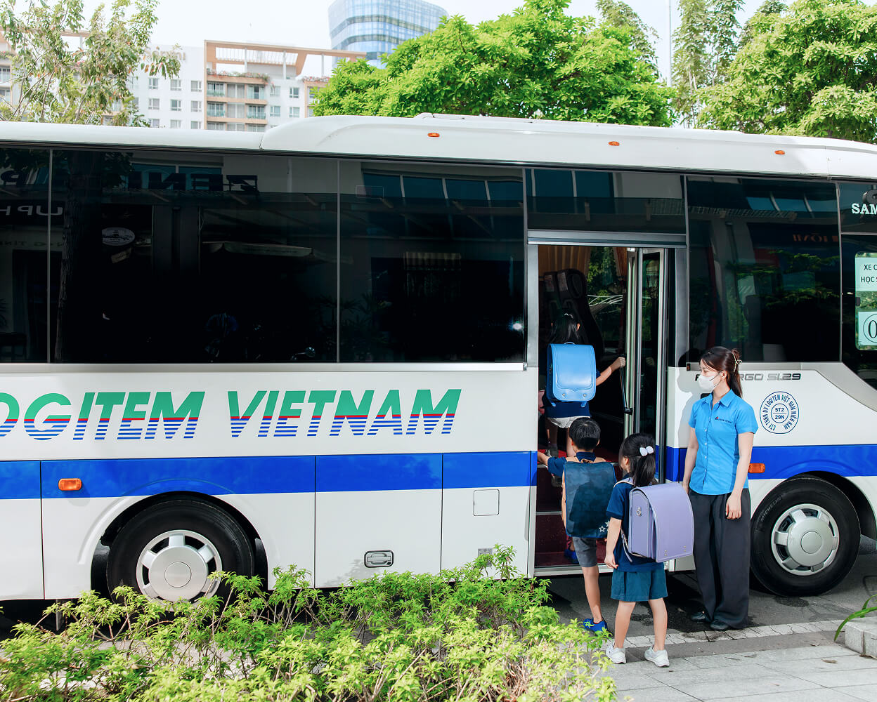 Elementary school children riding a school bus
