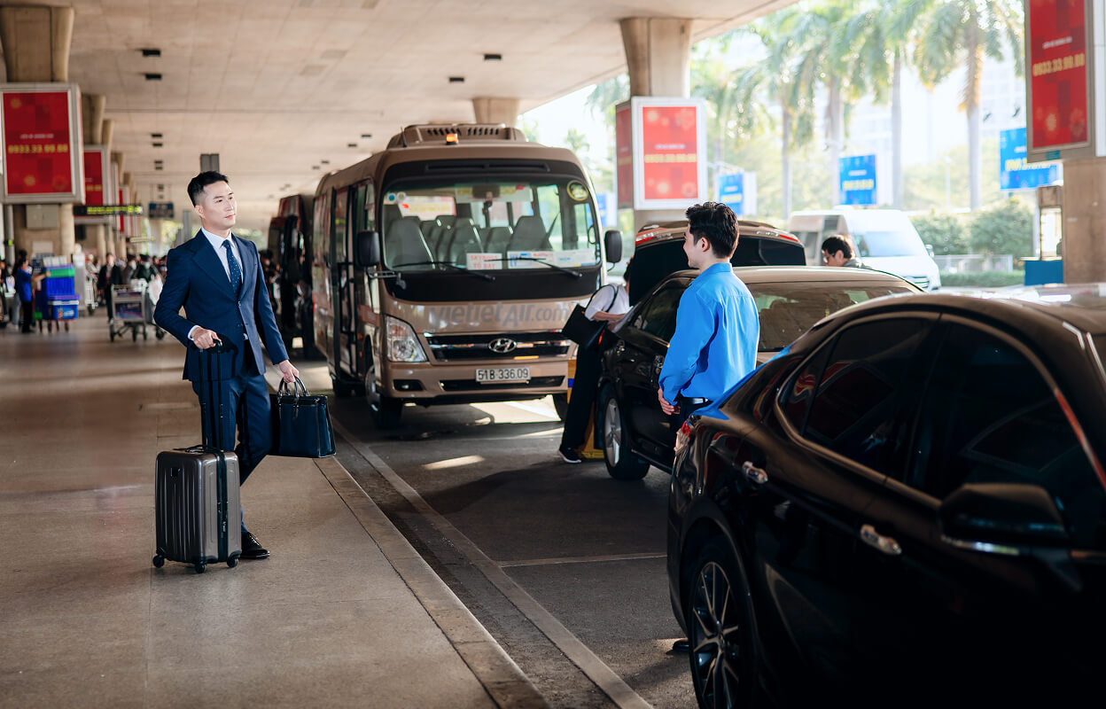 Driver greeting a businessman at the airport