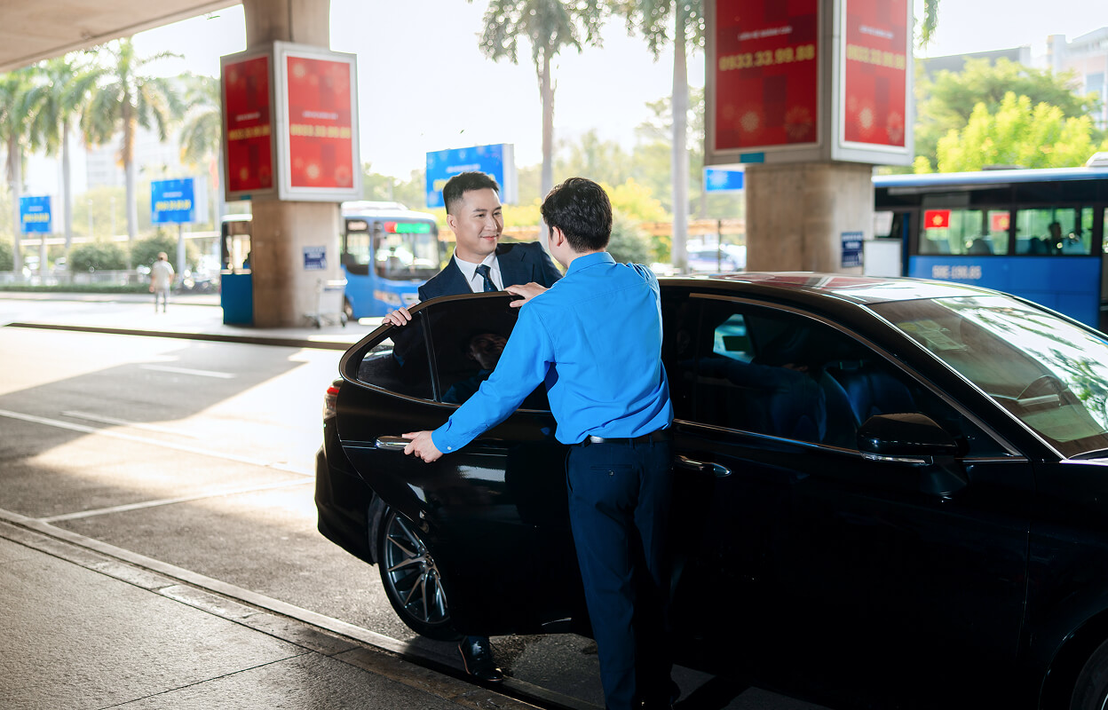 Businessman getting into a car