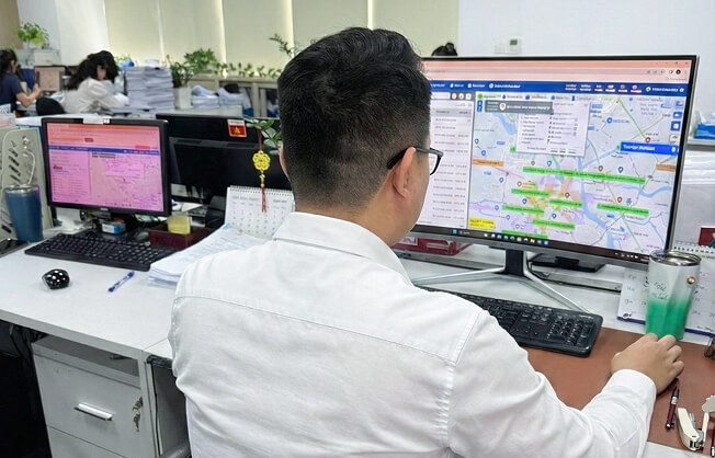 Logitem Vietnam staff managing operations with a computer